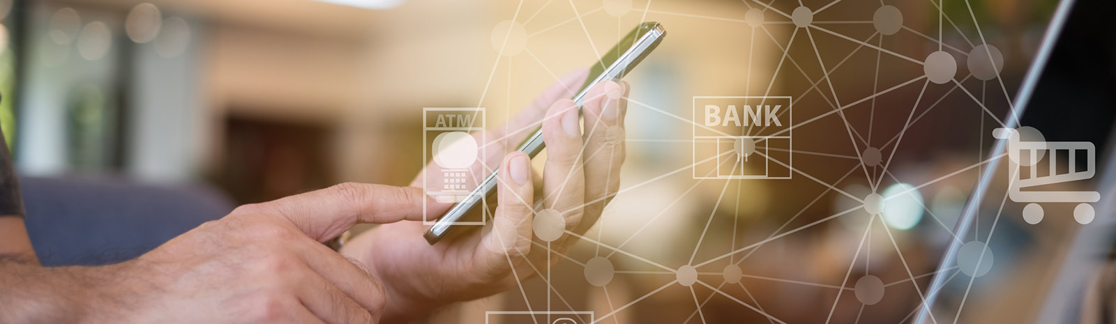 Man holding phone with banking images.