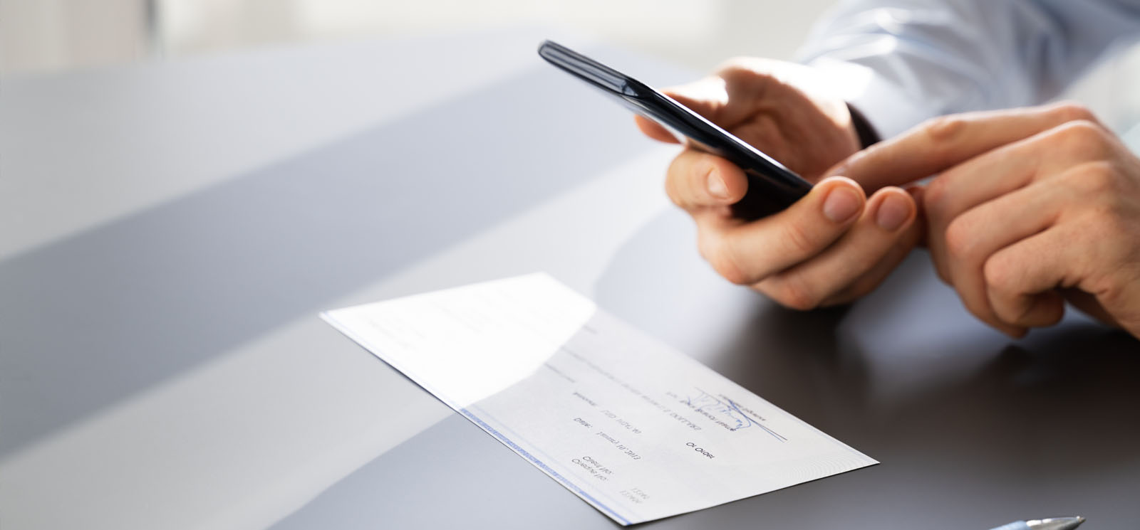 Mobile phone taking a picture of a check for mobile deposit.